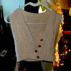 This vest is supposed to fit small, cropped.